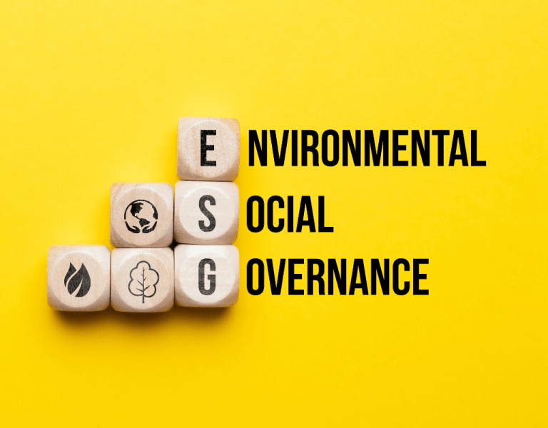 Wooden blocks. three spell out ESG - leading to read out Environment, Social and Governance.