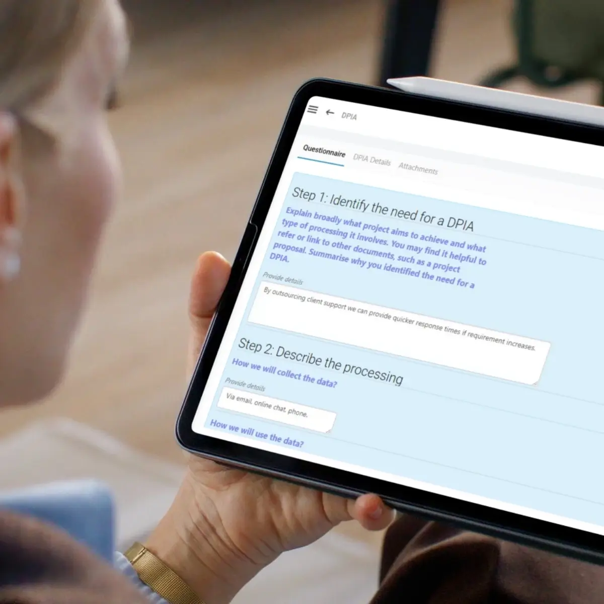Symbiant DPIA software showing structured Data Protection Impact Assessment questionnaire with real-time risk scoring and action tracking